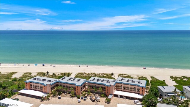 bird's eye view with a water view and a view of the beach