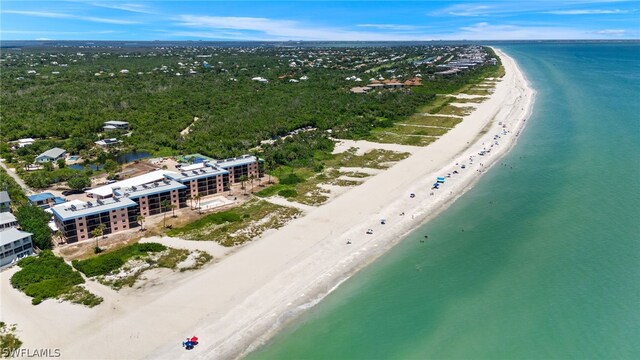 bird's eye view featuring a view of the beach and a water view