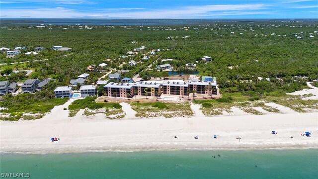 bird's eye view with a water view and a beach view