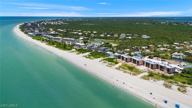 aerial view featuring a view of the beach and a water view