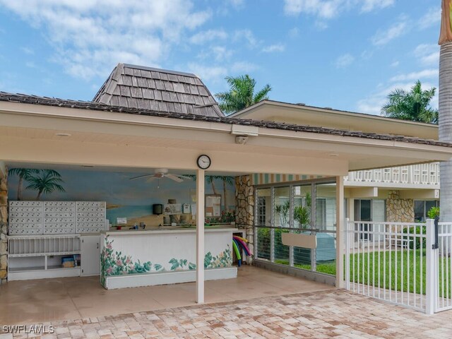 exterior space with ceiling fan