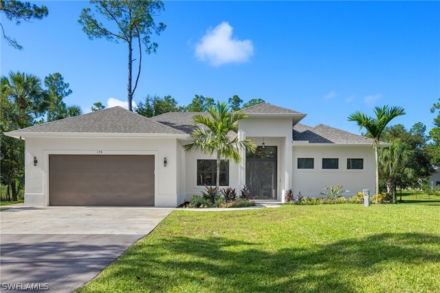 prairie-style home featuring concrete driveway, a front lawn, an attached garage, and stucco siding