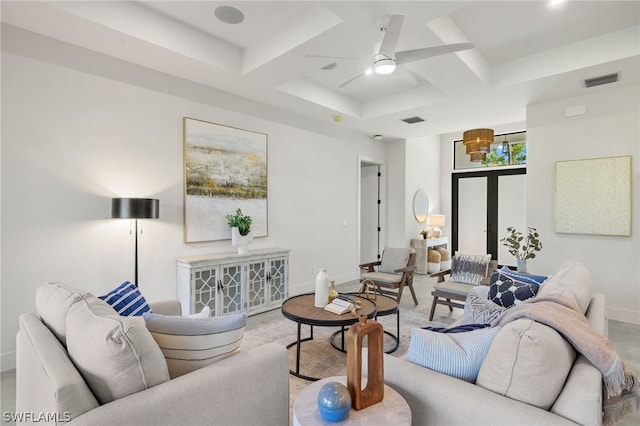 living room with coffered ceiling and ceiling fan