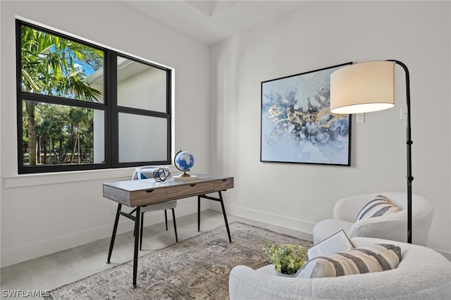 office space featuring plenty of natural light and baseboards