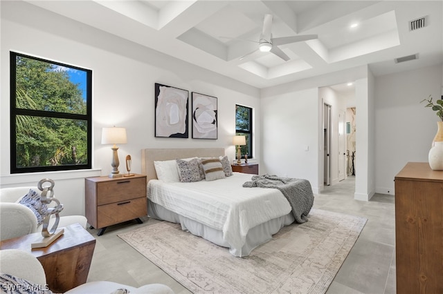 bedroom with multiple windows, coffered ceiling, and ceiling fan