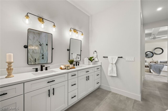 bathroom featuring tile patterned floors, beam ceiling, ceiling fan, dual bowl vanity, and coffered ceiling