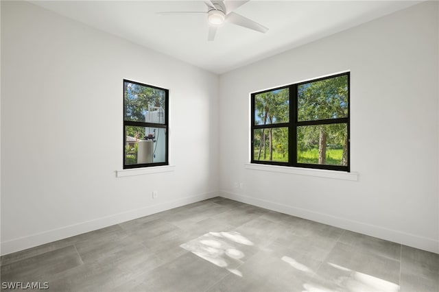 unfurnished room featuring ceiling fan