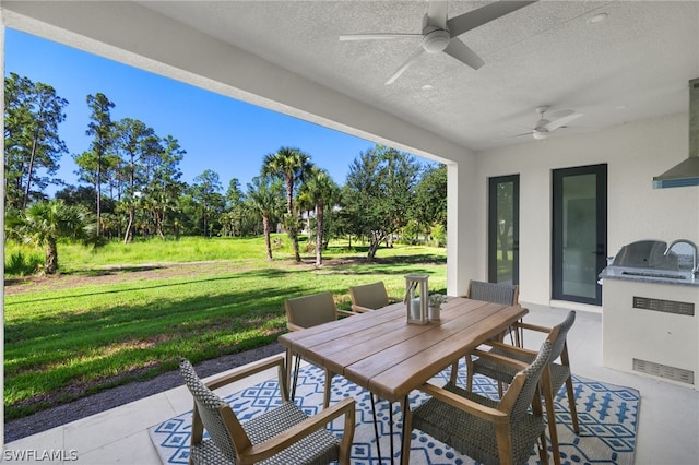 view of patio with ceiling fan