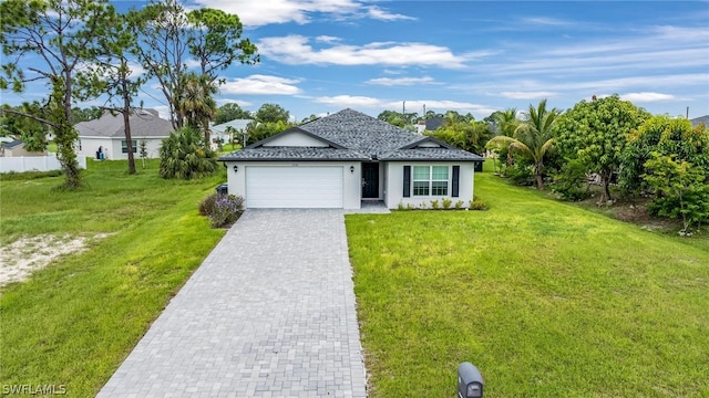 single story home featuring a garage and a front yard