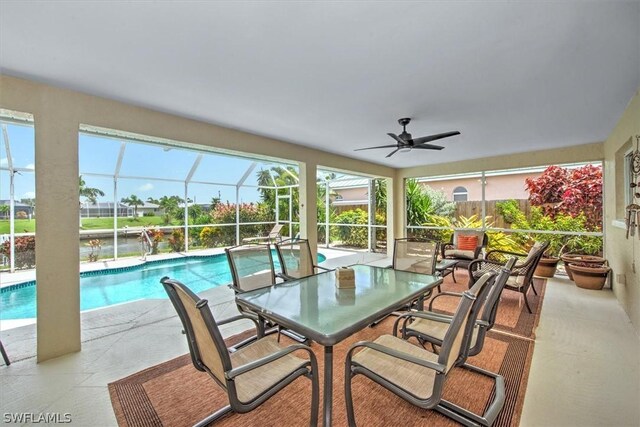 exterior space featuring a lanai and ceiling fan