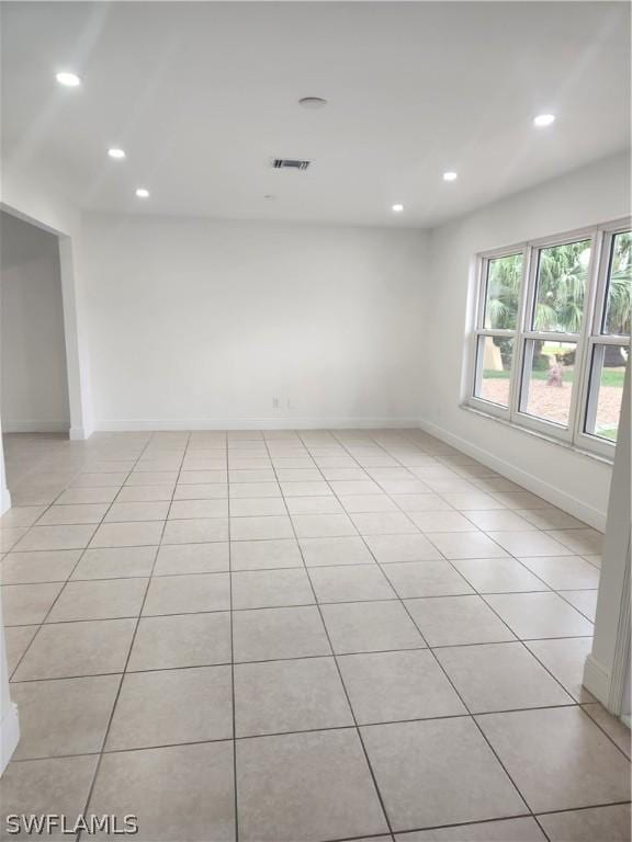 spare room with light tile patterned floors