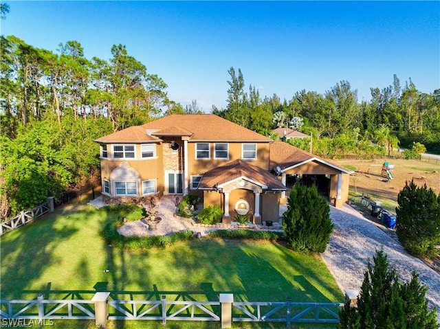 rear view of house with a yard