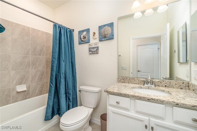 full bathroom featuring shower / tub combo, vanity, and toilet