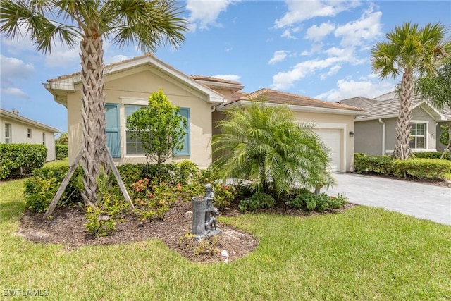 view of front of home featuring a garage and a front yard