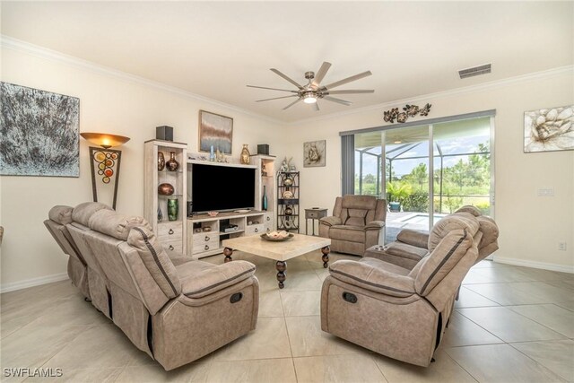 living room featuring ceiling fan, light tile patterned floors, and crown molding