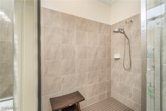 bathroom with a tile shower