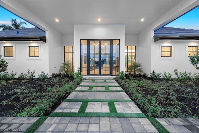 exterior entry at dusk with french doors