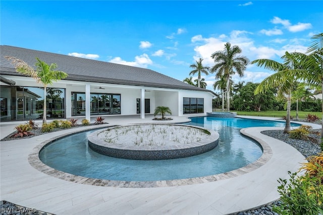 view of pool featuring a patio and ceiling fan