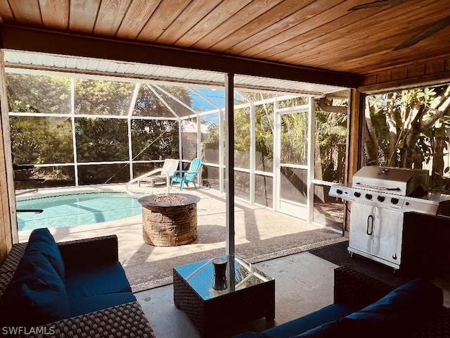 sunroom / solarium featuring wood ceiling