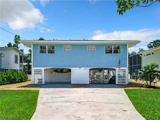 view of front of house featuring a front yard and a carport