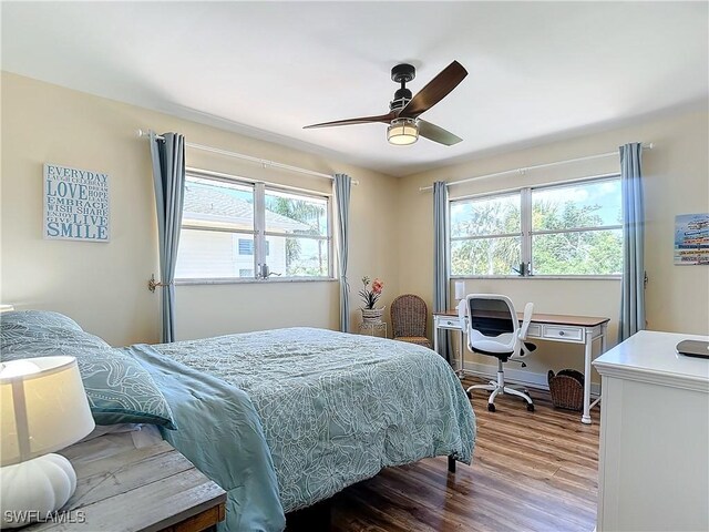 bedroom featuring light wood-type flooring and ceiling fan