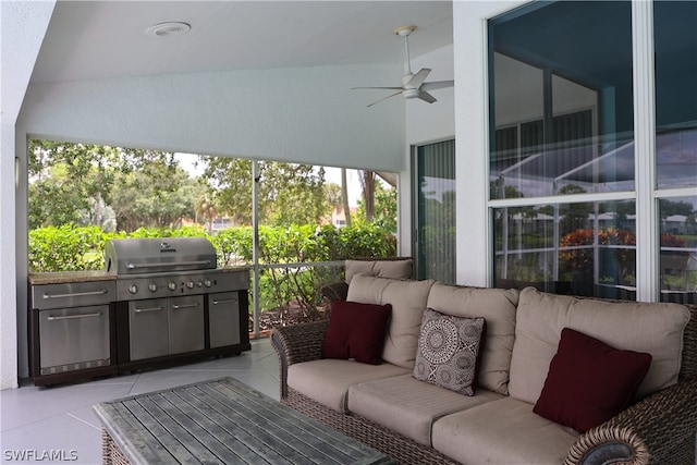 exterior space featuring ceiling fan, area for grilling, exterior kitchen, and outdoor lounge area