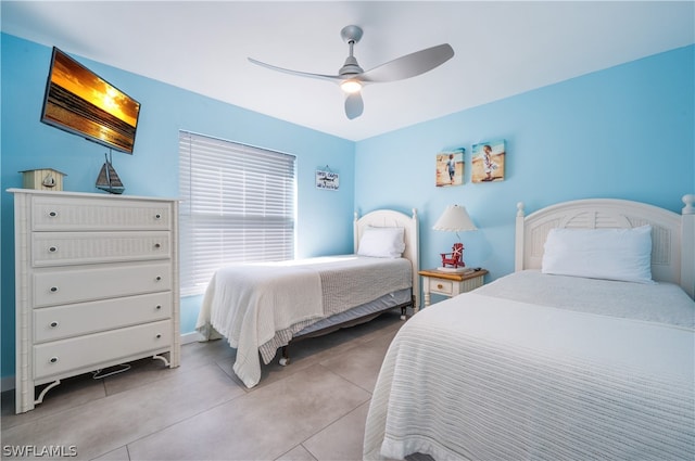 bedroom with light tile patterned flooring and ceiling fan