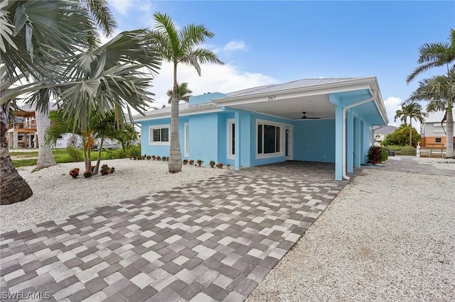 rear view of property with a carport