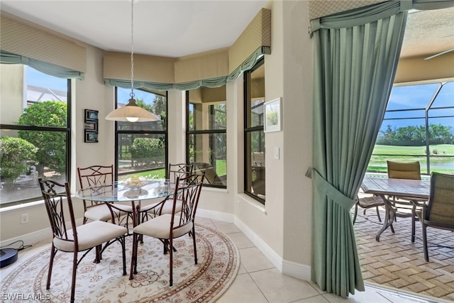 dining space featuring light tile patterned floors and a wealth of natural light