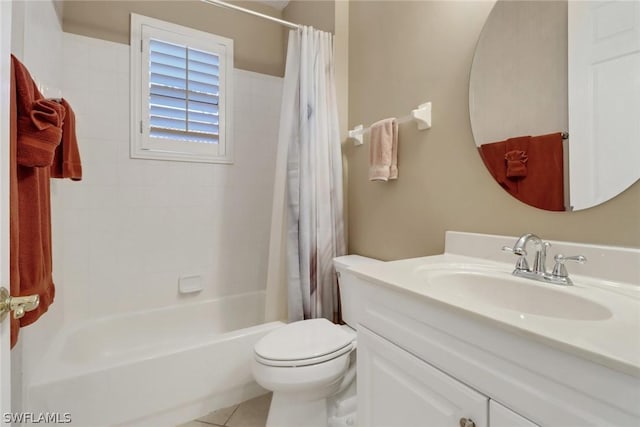 full bathroom with vanity, tile patterned floors, toilet, and shower / bath combo with shower curtain