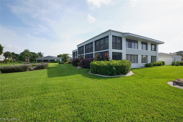 16580 Waters Edge Ct Unit 102, Fort Myers, FL 33908 - rear view of property featuring a lawn