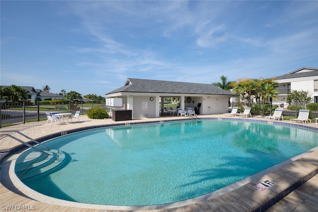 16580 Waters Edge Ct Unit 102, Fort Myers, FL 33908 - community pool with fence and a patio area