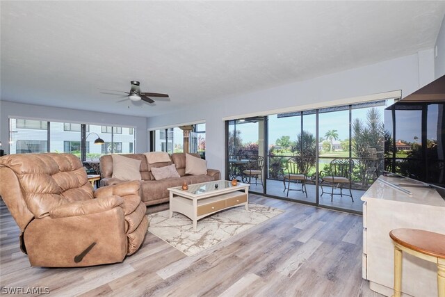 16580 Waters Edge Ct Unit 102, Fort Myers, FL 33908 - living room with a ceiling fan and light wood-type flooring