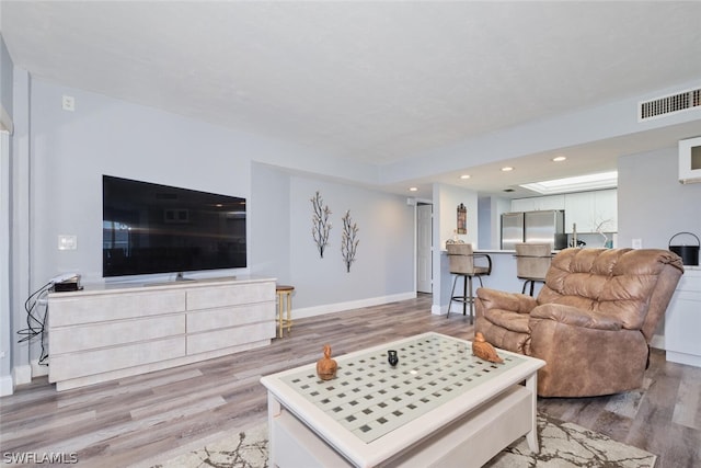16580 Waters Edge Ct Unit 102, Fort Myers, FL 33908 - living room featuring baseboards, visible vents, recessed lighting, and light wood-type flooring