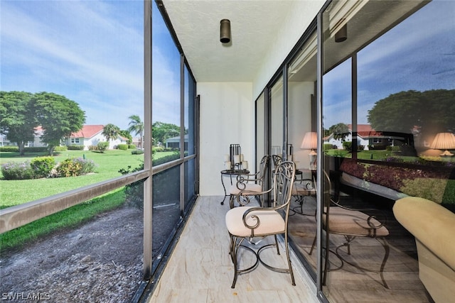 16580 Waters Edge Ct Unit 102, Fort Myers, FL 33908 - sunroom with floor to ceiling windows and a textured ceiling