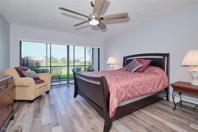 16580 Waters Edge Ct Unit 102, Fort Myers, FL 33908 - bedroom featuring baseboards, access to outside, a ceiling fan, and light wood finished floors