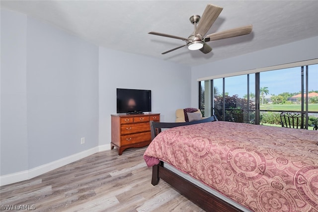 bedroom featuring light hardwood / wood-style flooring, access to outside, and ceiling fan