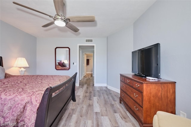 bedroom featuring light hardwood / wood-style floors and ceiling fan