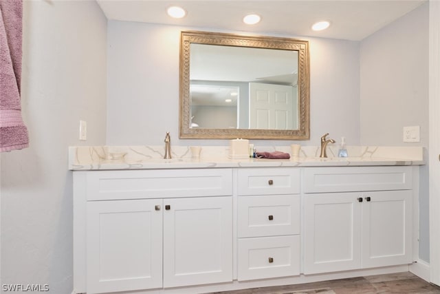 16580 Waters Edge Ct Unit 102, Fort Myers, FL 33908 - bathroom featuring double vanity, recessed lighting, and a sink