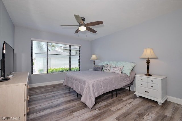 bedroom featuring wood-type flooring and ceiling fan