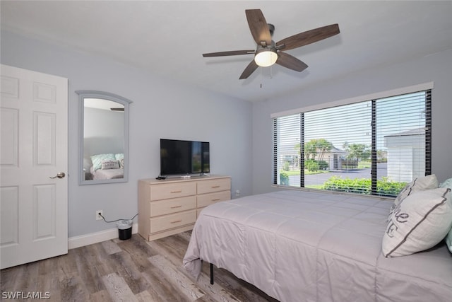 16580 Waters Edge Ct Unit 102, Fort Myers, FL 33908 - bedroom with baseboards, ceiling fan, and wood finished floors