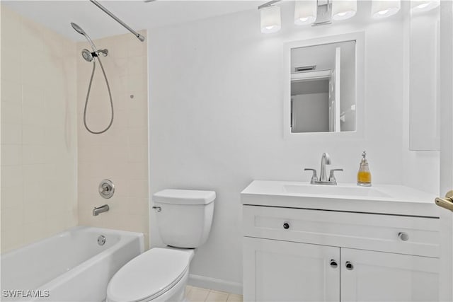 full bathroom with toilet, vanity, and tiled shower / bath