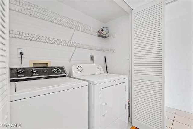 washroom featuring independent washer and dryer