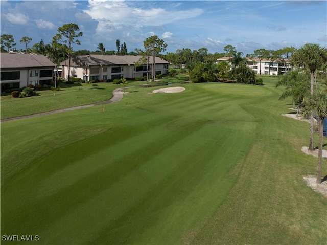 view of property's community featuring a lawn