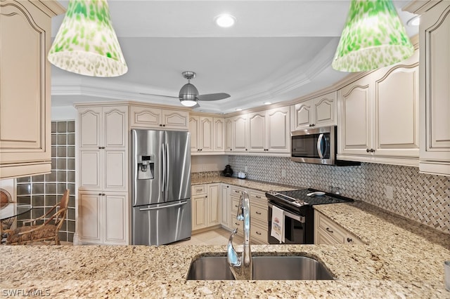 kitchen with sink, ceiling fan, stainless steel appliances, and backsplash