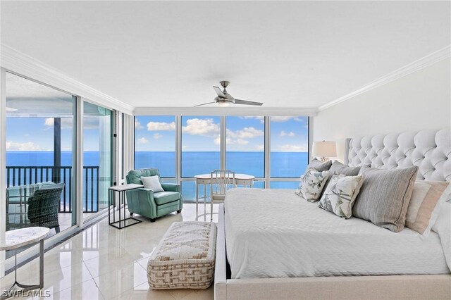 tiled bedroom featuring a water view, crown molding, and multiple windows