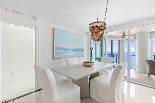 dining room with a water view, crown molding, light tile patterned floors, and ceiling fan