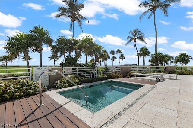 view of pool featuring a patio and a community hot tub