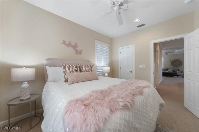 carpeted bedroom with ceiling fan