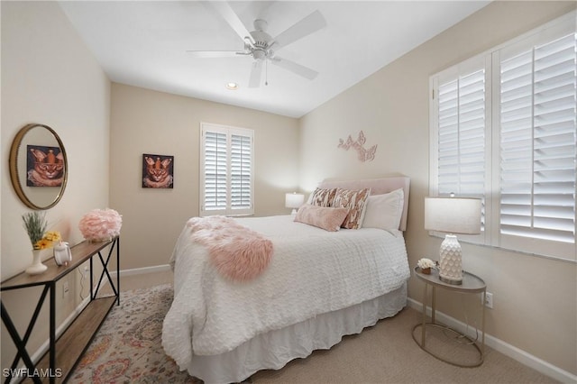 carpeted bedroom with ceiling fan